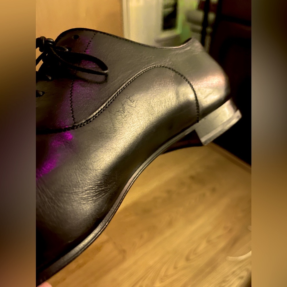 Christian Louboutin Men’s Black Calf Leather Oxfords with genuine red bottoms.